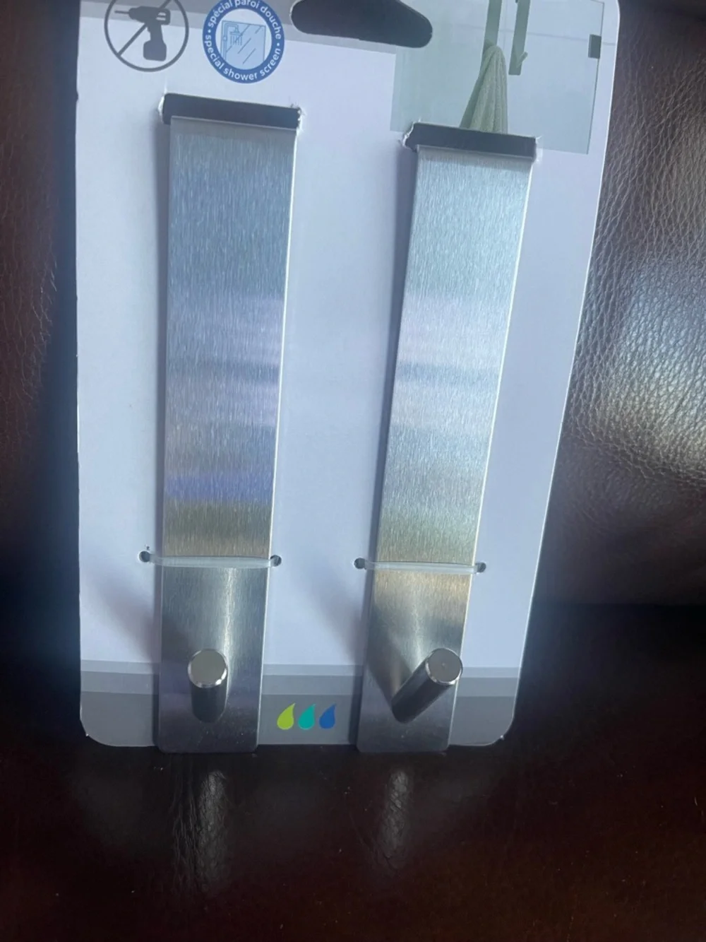 Over the shower towel holder, shower door hooks